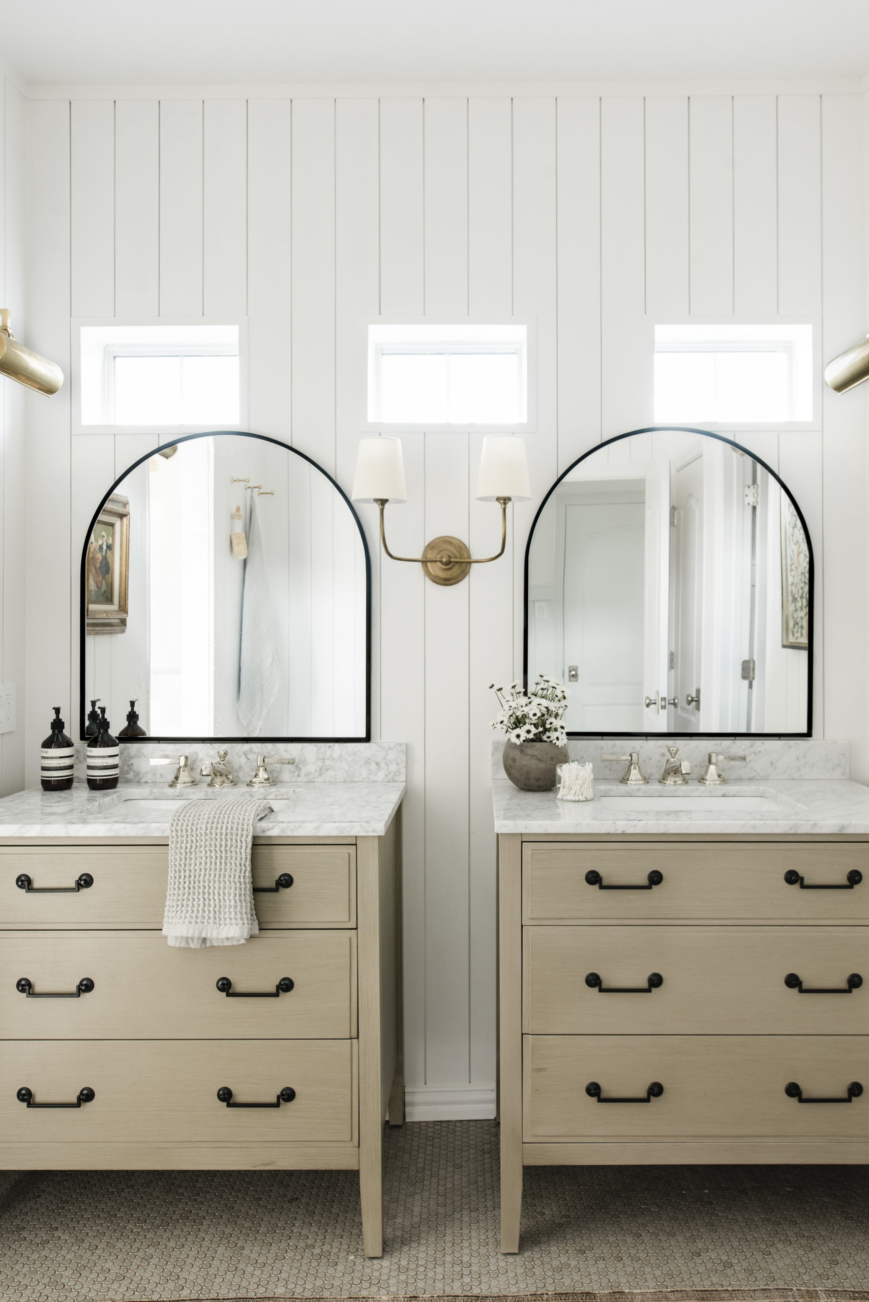 Double arm brass sconce in the best bathroom sconces, design by Anastasia Casey